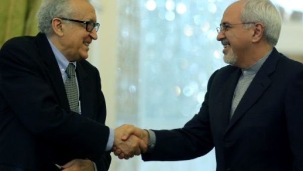 UN envoy Lakhdar Brahimi told reporters in Iran following his meeting with Iran's Foreign Minister Javad Zarif that Tehran's participation in the proposed Geneva talks is "necessary" (AFP) 
