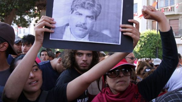 Demonstrators hold a picture of slain opposition figure Mohamed Brahmi on July 25 in Tunis (AFP / Khalil)