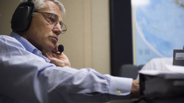 US Secretary of Defense Chuck Hagel speaks with French Minister of Defense Jean-Yves Le Drian from his plane on Tuesday. (AFP)