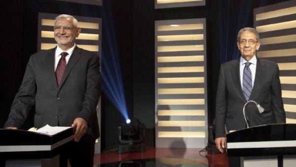 Presidential candidate and former Arab League Secretary General Amr Mussa (R) and moderate Islamist candidate, Abdelmoneim Abul Fotouh, during a live debate in Cairo.