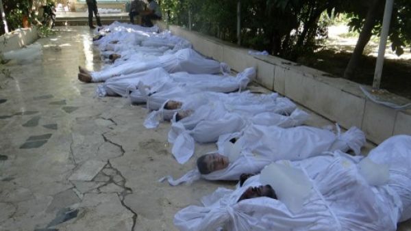 Bodies of children killed in the August chemical attacks lie in a makeshift morgue in Damascus on August 22, 2013. A recent study shows that 11,420 children have died in the Syrian conflict so far (AFP/File)