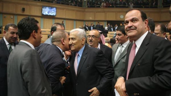 Deputies congratulate Prime Minister Abdullah Ensour after his government won the Parliament's vote of confidence on Tuesday (Photo by Hasan Tamimi)