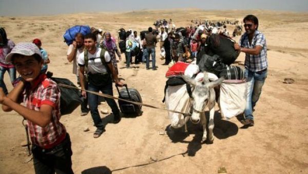 الاف الاكراد الجائعين والخائفين يتدفقون الى العراق من سوريا
