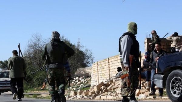 Libyan militant groups clashed in Tripoli's western suburbs leaving at least five dead and 20 injured (AFP)