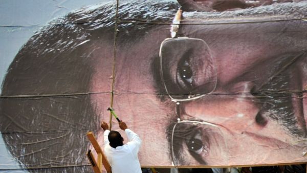 A supporter builds a giant portrait of deposed president Mohammad Morsi on July 25 in Cairo. (AFP / Fayez Nureldine)