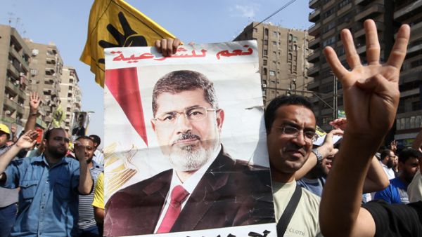"I am the legitimate president," Morsi shouted during his trial in Cairo on Tuesday. (AFP/File)