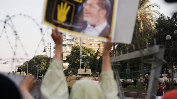  Hundreds of Muslim Brotherhood members and supporters of ousted President Mohammed Morsi, rally outside the Presidential Palace. (Image credit: AFP) 