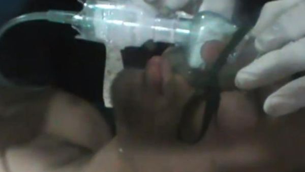 Pictured: Patient in Homs allegedly suffering from gas poisoning. (Screen grab taken from Youtube)