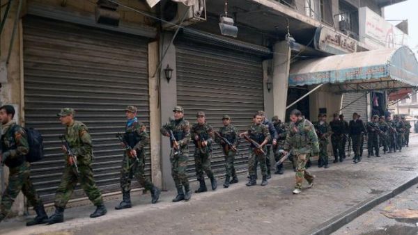 Syrian government forces deploy themselves in the streets of Syria's second city Aleppo. (AFP PHOTO / STR)