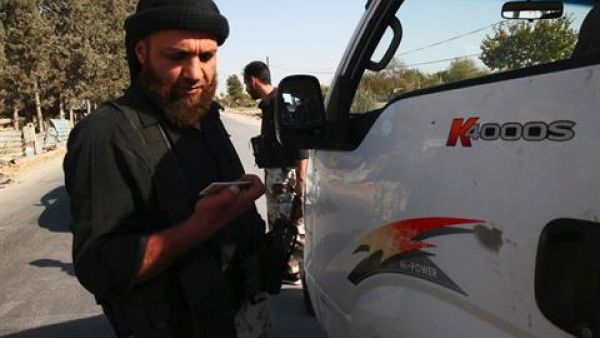 The suicide bombers reportedly detonated at a checkpoint manned by regime forces in Qara (Bassam Khabieh/Reuters)
