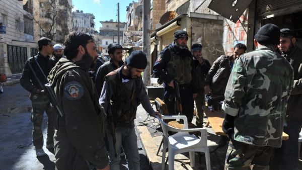 Syrian rebel fighters prepare to go into battle in Aleppo. (AFP PHOTO/BULENT KILIC)