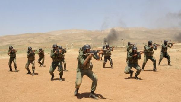 صورة بثتها وكالة الانباء السورية لمجموعة من قوات النظام خلال تدريب في منطقة لم يكشف النقاب عنها