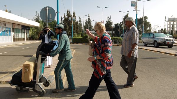 A foreign national walks towards the departure area of Sanaa International Airport before leaving Yemen (AFP/MOHAMMED HUWAIS) 