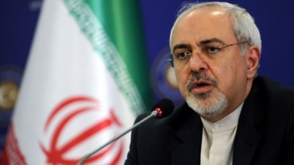 Iranian FM Mohammad Javad Zarif told reporters that Tehran is "committed" to implementing an interim nuclear deal (File Archive/AFP)