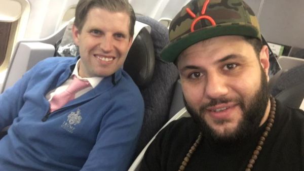 Eric Trump seated next to Mo Amer on a flight to Glasgow. (Facebook)