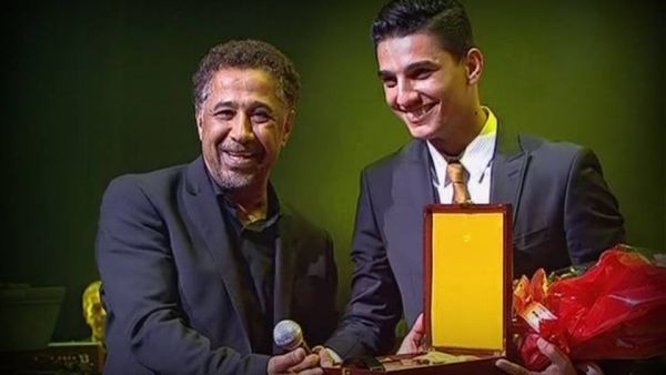 Assaf receives an award from Cheb Khaled in Algeria. (Facebook)