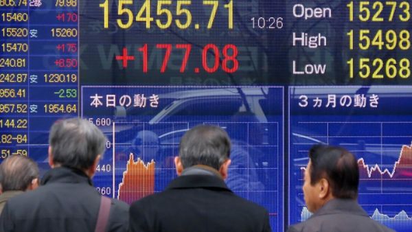 Japan's Nikkei 225 index fell 7.1 percent to 21,087.71 by early Tuesday afternoon, after a wild day for U.S. stock markets. (AFP)