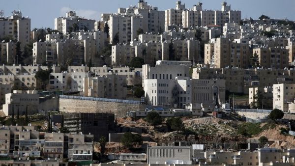 A file picture from the Palestinian village of Hizma shows the new housing units in the Jewish settlement of Neve Yaakov in the northern area of east Jerusalem. (AFP/Thomas Coex)