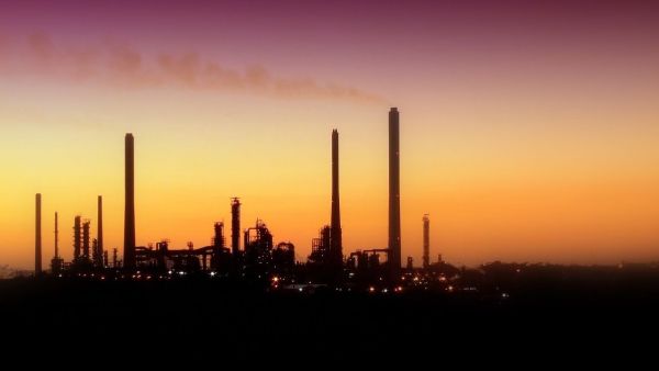 An oil refinery draws out the skyline. (Twitter)