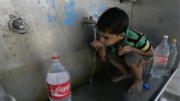 A Palestinian boy drinking water in the Gaza Strip. (AFP/File)