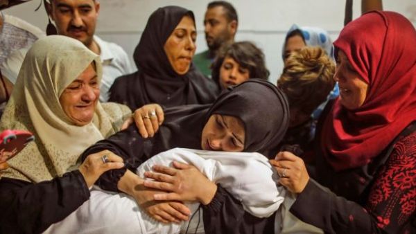 The mother of Layla Ghandour, a Palestinian baby of eight months who died during Monday’s violence in Gaza. (AFP/ File)