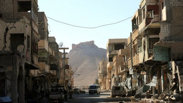 A picture taken on March 31, 2016 from the adjacent modern town shows a view of Fakhr-al-Din al-Ma'ani Castle, known as Palmyra citadel, on a hilltop in the ancient city of Palmyra, some 215 kilometres northeast of Damascus. (AFP/Joseph Eid)