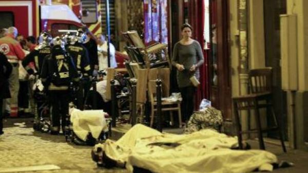 Victims of the November 13 Paris attacks are covered in white sheets after being declared dead at the scene. (AFP/File)