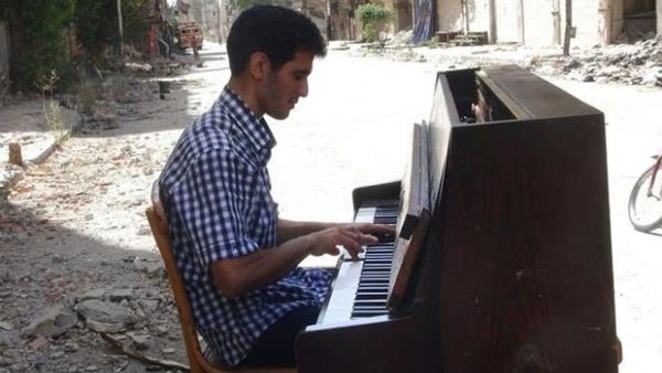 "The piano wasn't just an instrument. It was like the death of a friend," Aeham al-Ahmad told AFP. His piano burnt in front of him by Daesh fighters earlier this year, he has since then begun the long journey to a better life in Germany.  (AFP/File)