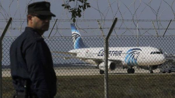 A shot of Cypriot police beside the hijacked aircraft in Cyprus. (Twitter)