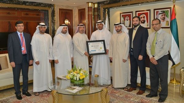 Ahmed Mahboob Musabih and Juma Al Ghaith in a group photo with the project team