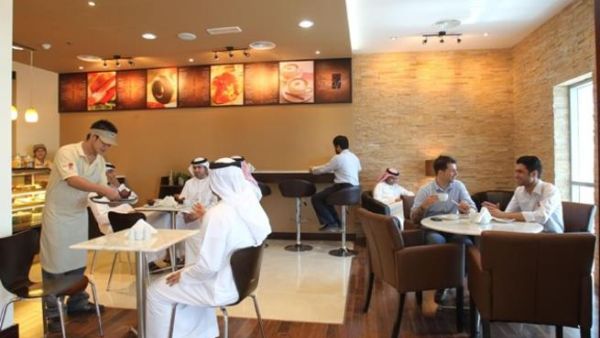 Customers relaxing in the coffee shop at Al Barsha Registration Centre of Emirates Identity Authority Customers relaxing in the coffee shop at Al Barsha Registration Centre of Emirates Identity Authority