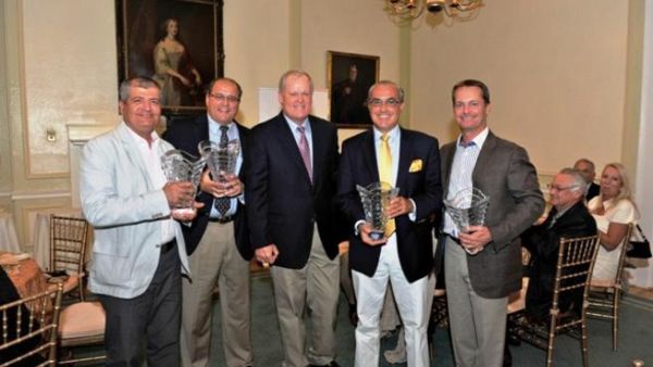 Team Emal 1 receive their trophies from twice Major Champion winner and respected NBC and Golf Channel golf analyst, Johnny Miller Team Emal 1 receive their trophies from twice Major Champion winner and respected NBC and Golf Channel golf analyst, Johnny Miller