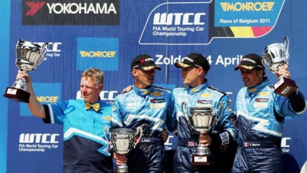 Chevrolet Cruze winning team on podium in one of the previous races in 2011 Chevrolet Cruze winning team on podium in one of the previous races in 2011