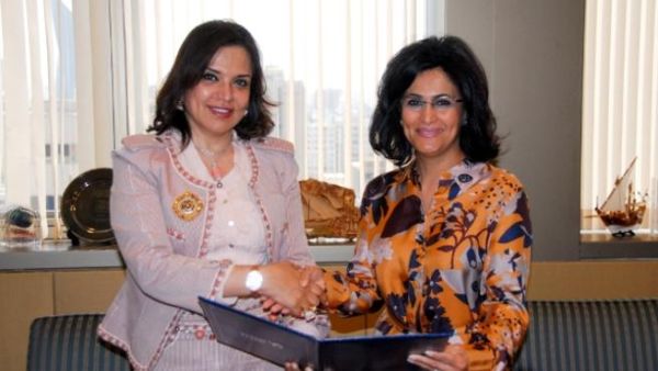 KALD Chairwomen Amal Al Sayer receives the sponsorship check from NBK CEO Shaikha Al Bahar