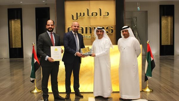 DED officials honouring Damas