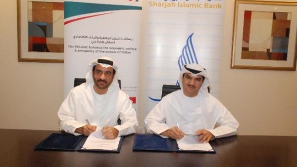 Khalid Al Kassim, Deputy Director General for Executive Affairs, DED with Mohammed Abdulla, CEO of SIB