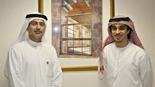 Mohammed Sharaf, CEO, DP World, and Farid Mohammed Al Rais, with the Auctioned Painting