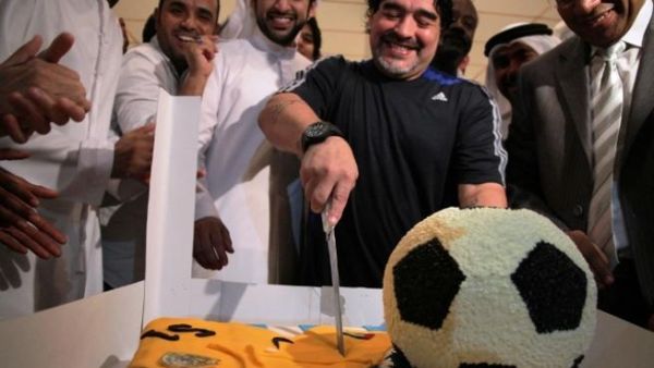 Diego Maradona cutting his birthday cake Diego Maradona cutting his birthday cake