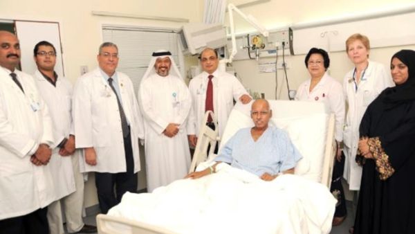 Doctors with patient and his wife at Hamad Medical Corporation