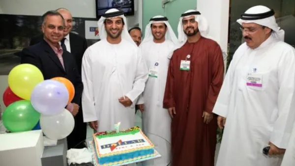 Sheikh Sultan Bin Ahmed Al Qassimi, Chairman of the Sharjah Commerce and Tourism Development Authority celebrating with Dollar Rent A Car team