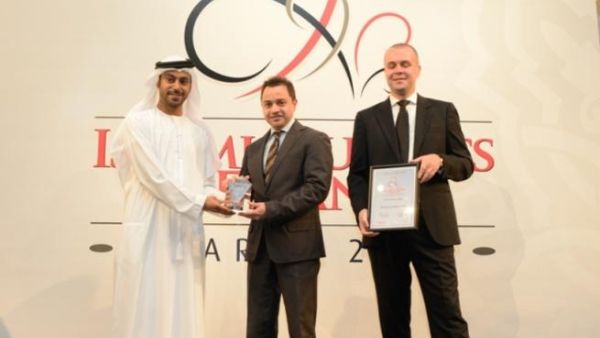 Adnan Chilwan, Deputy Chief Executive Officer, DIB (centre) receiving IB&F award 2012