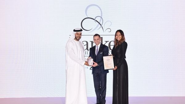 Dr. Adnan Chilwan, Group CEO at DIB receiving the award.
