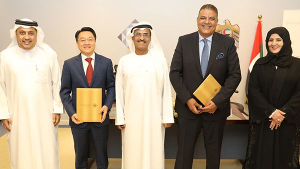 Dr Al Nuaimi with officials of the companies at the signing ceremony.