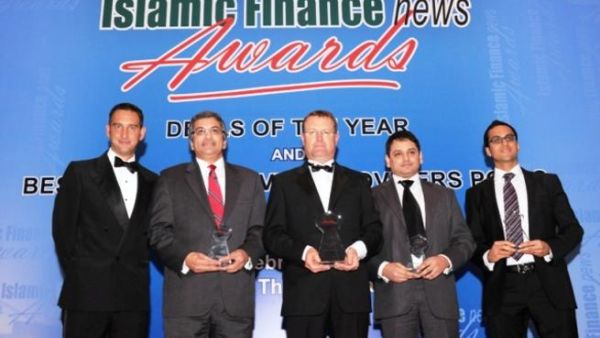 DIB collecting the award during a ceremony held at the Dusit Thani Hotel in Dubai