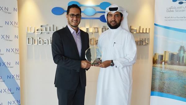 Engineer Muammar Al Katheeri and Ghazi Atallah carrying the award.