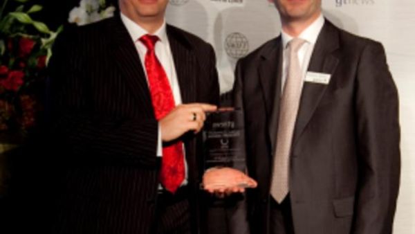 Etihad Airways Vice President Treasury, Ricky Thirion (left) accepts the award