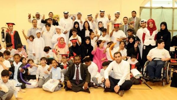 Daman's Thiqa employees with ZHO students and staff Daman's Thiqa employees with ZHO students and staff