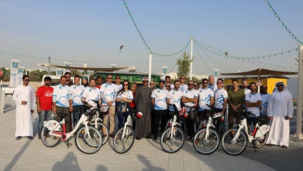 Masdar and ADBC employees celebrate the launch of Mamsha Masdar, a bike and fitness trail around Masdar City which includes two new ADCB Bikeshare stations.