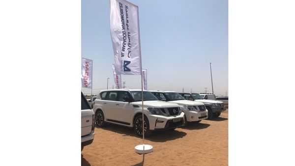 The annual Rmdha Challenge requires all participants to walk barefoot in the hot desert sand over the set distance, with breaks allowed at specific rest points throughout the course.