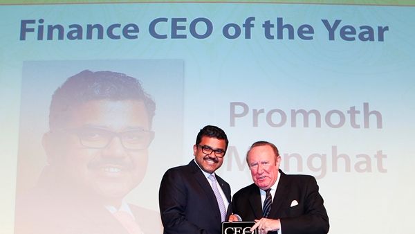 Mr. Promoth Manghat, CEO, UAE Exchange, receiving the award from Mr. Andrew Neil, Chairman, ITP Publishing, the BBC Broadcaster and former Sunday Times editor - “Photograph, courtesy of ITP Executive Publishing”